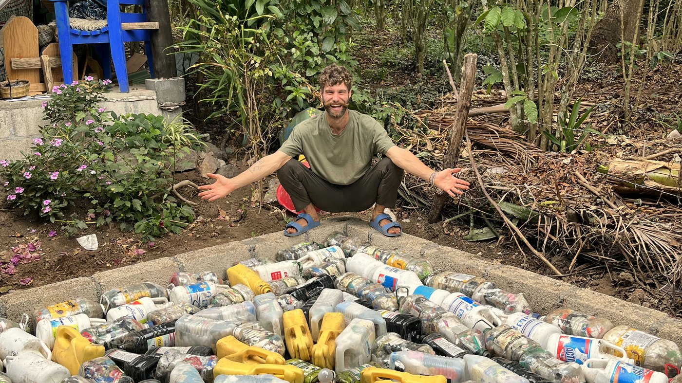 Will and the team building a foundation from eco-bricks at the Mystical Yoga Farm