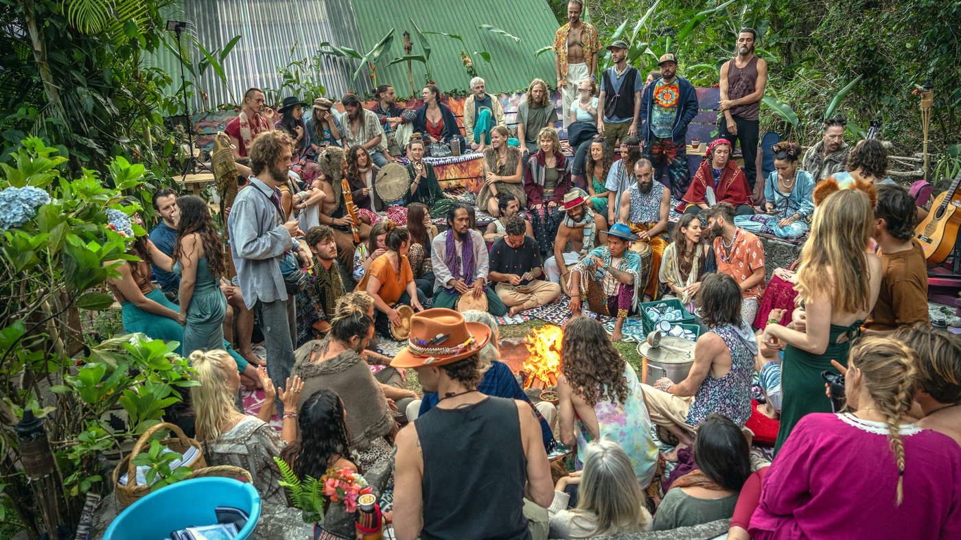 The Heartsong Festival fire circle at dusk, with around 200 people gathered